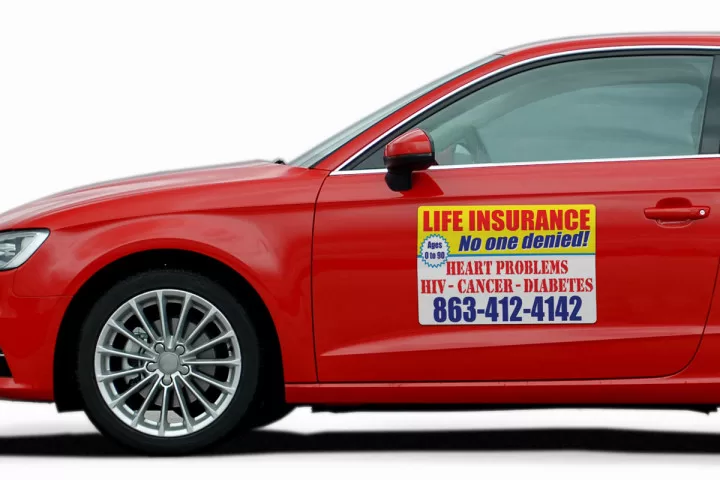 Red vehicle with custom magnet for advertising